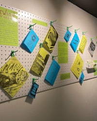 a peg board with a lot of notes on it